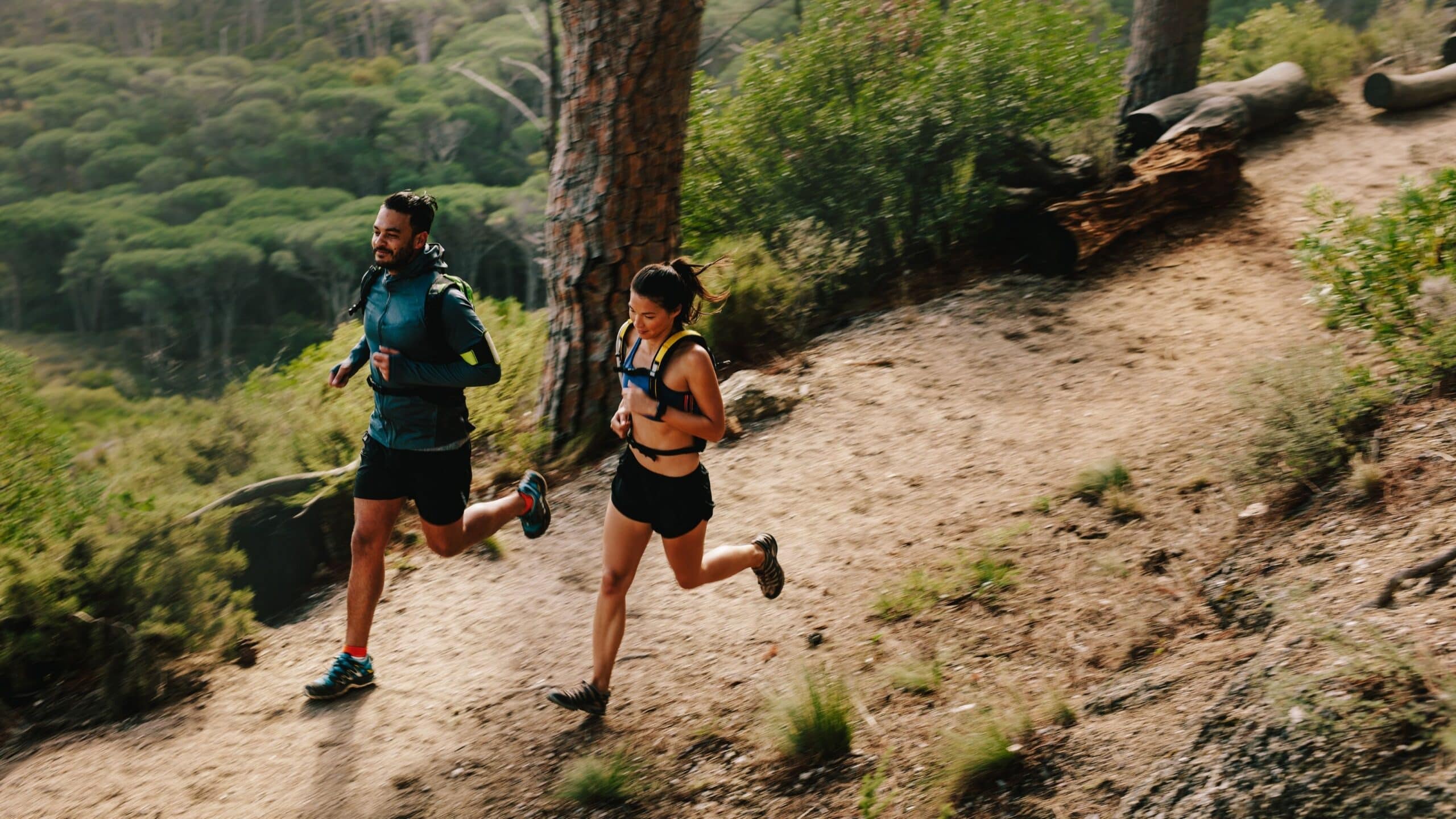People trail running during the summer